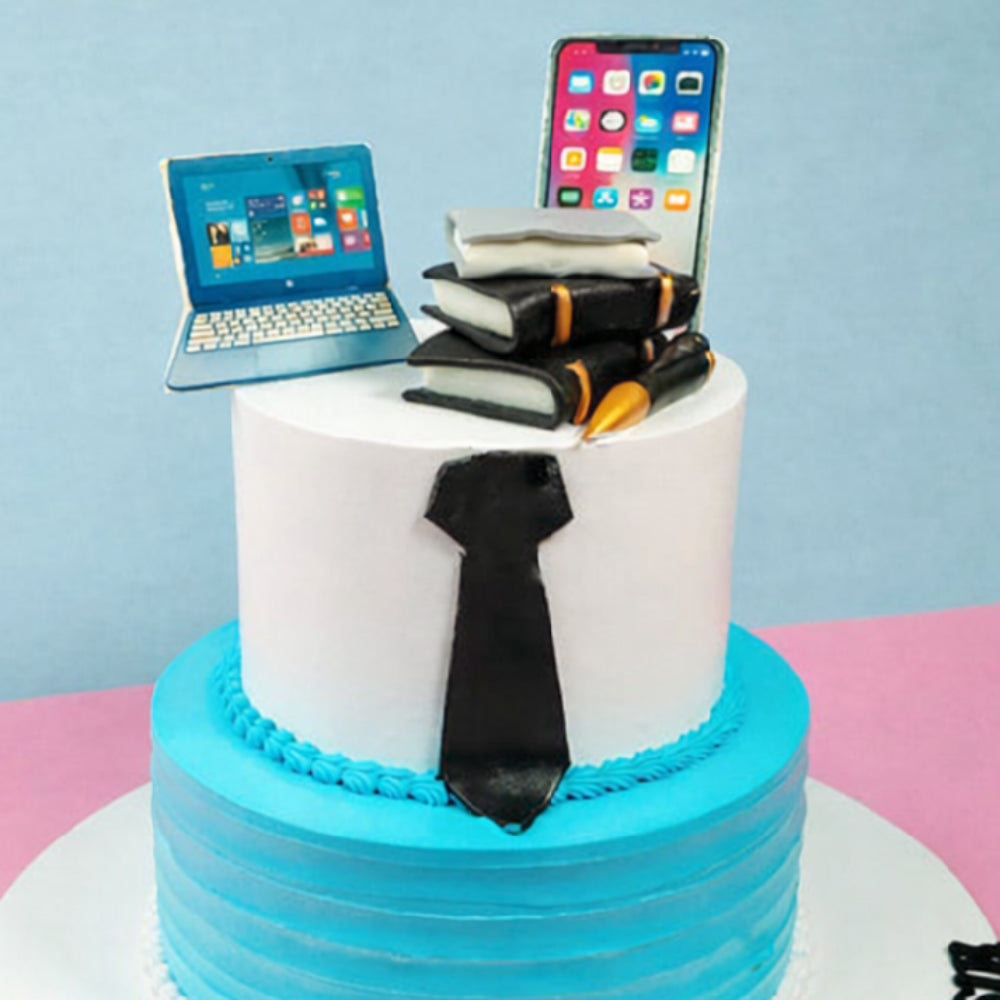 Gemini said
Two-tier professional birthday cake with laptop, phone, books, and tie toppers.