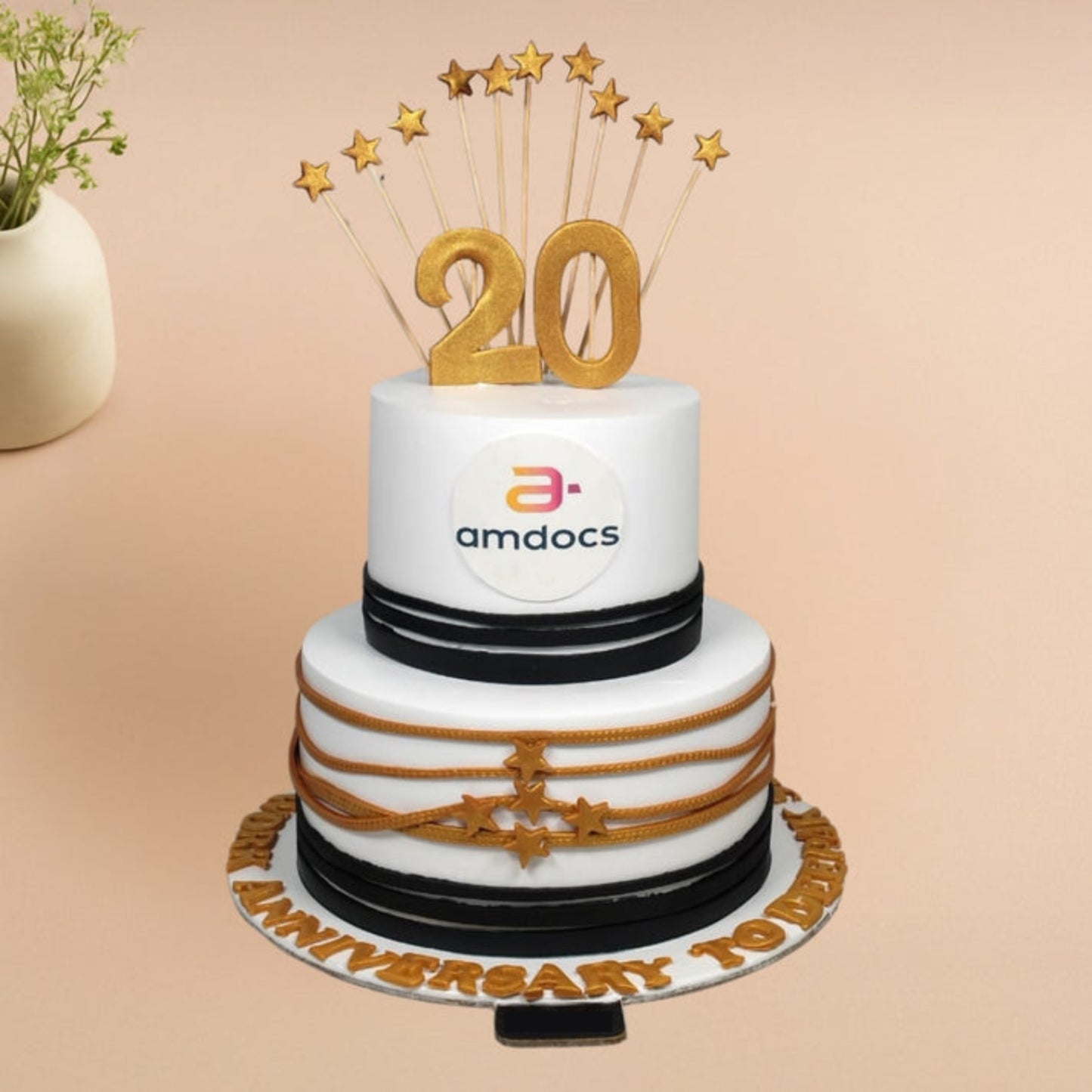premium two-tier corporate anniversary cake with gold 20 topper and elegant office celebration design