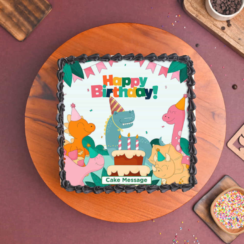 Children's birthday cake with dinosaur design on a wooden board