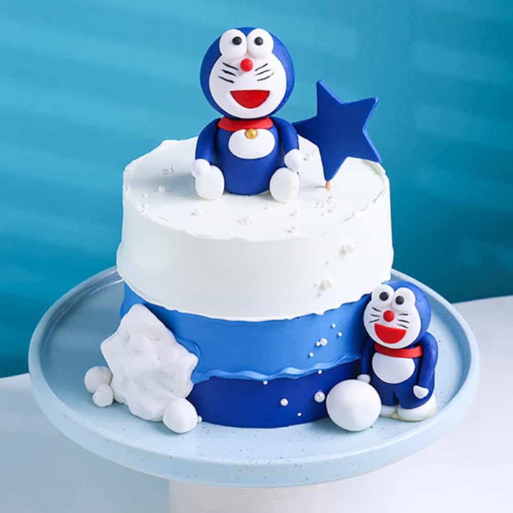 Cake with Doraemon figurines on a blue background