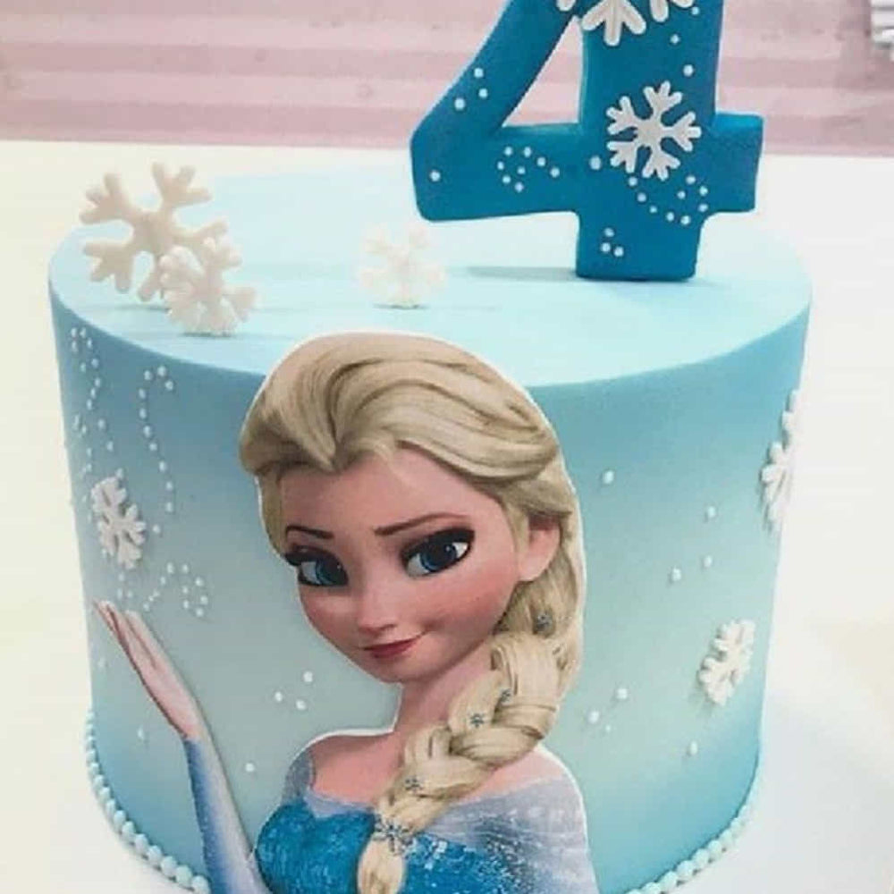 Cake with Elsa from Frozen design, featuring a number 4 candle.
