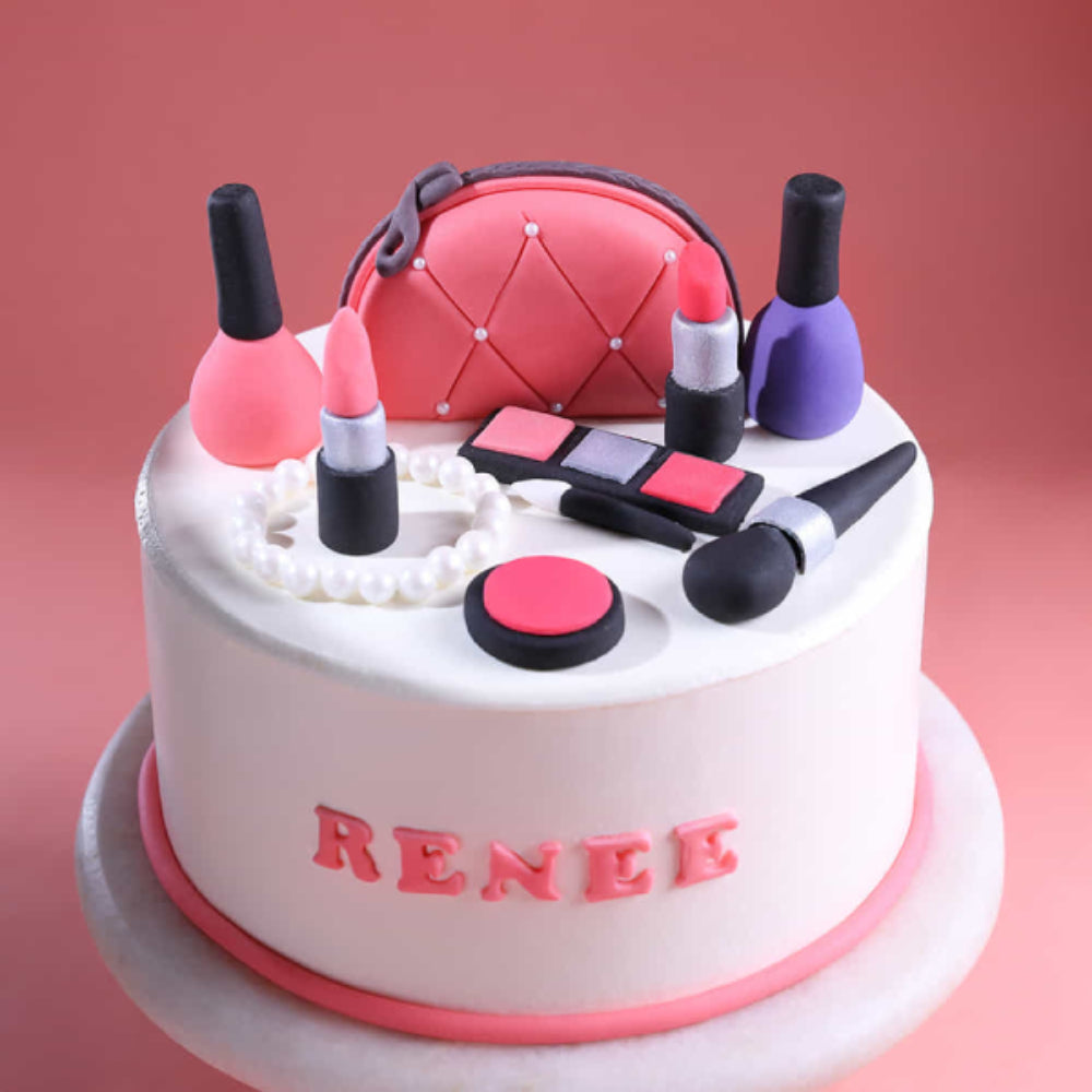 Makeup theme designer cake with lipstick, nail polish, cosmetics, and name design, perfect for birthday celebrations in Delhi.