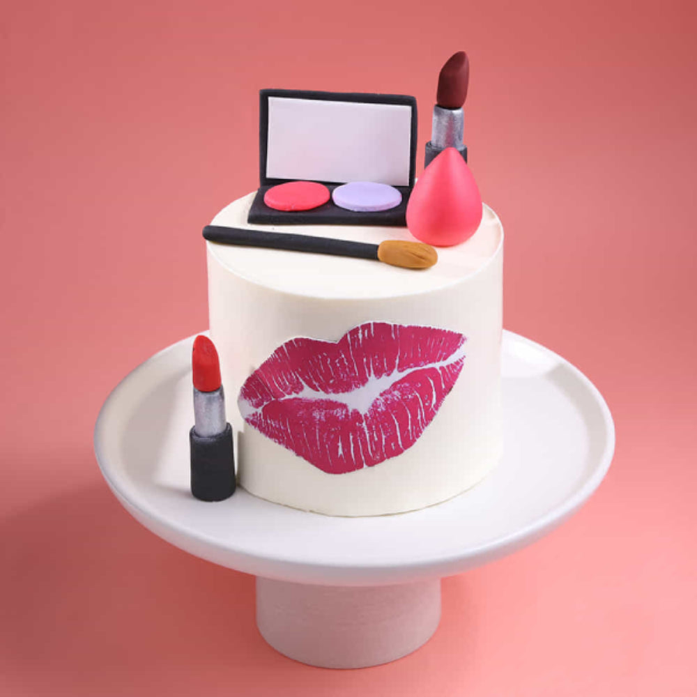 Stylish makeup theme designer cake with lipstick, eyeshadow palette, and lip print, ideal for girls’ birthday party in Delhi.