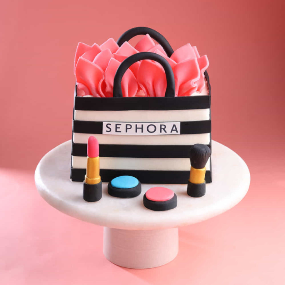 Makeup theme designer cake with lipstick, nail polish, cosmetics, and name design, perfect for birthday celebrations in Delhi.
