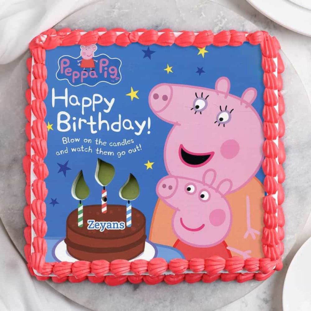 A square Peppa Pig-themed birthday cake with white frosting and a red piped border. The edible image topper features Peppa and Mummy Pig on a blue background, personalized with the name "Zeyans."