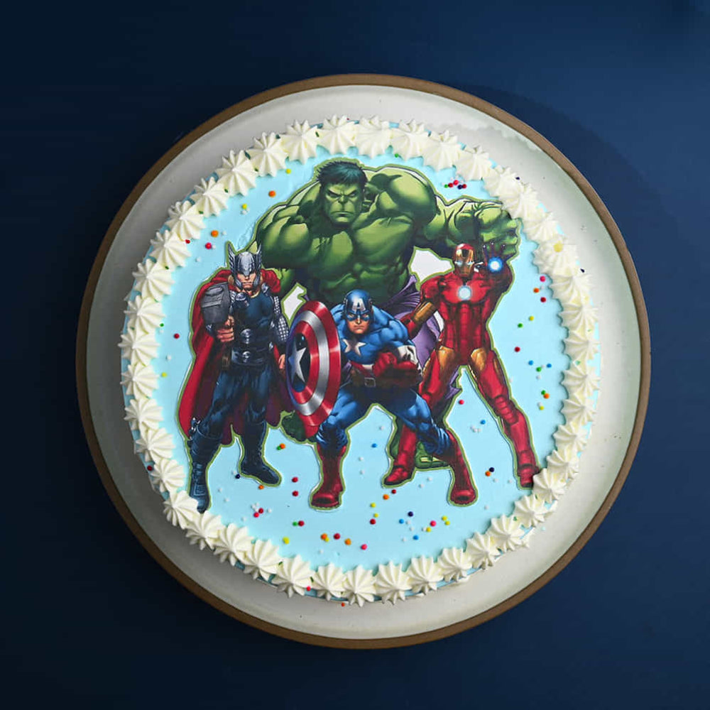 Cake with superhero figures on a blue background