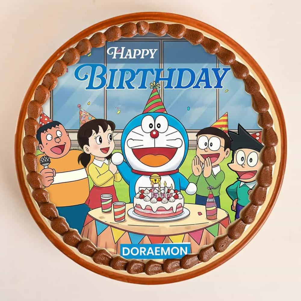 Doraemon birthday cake with cartoon characters and 'Happy Birthday' text