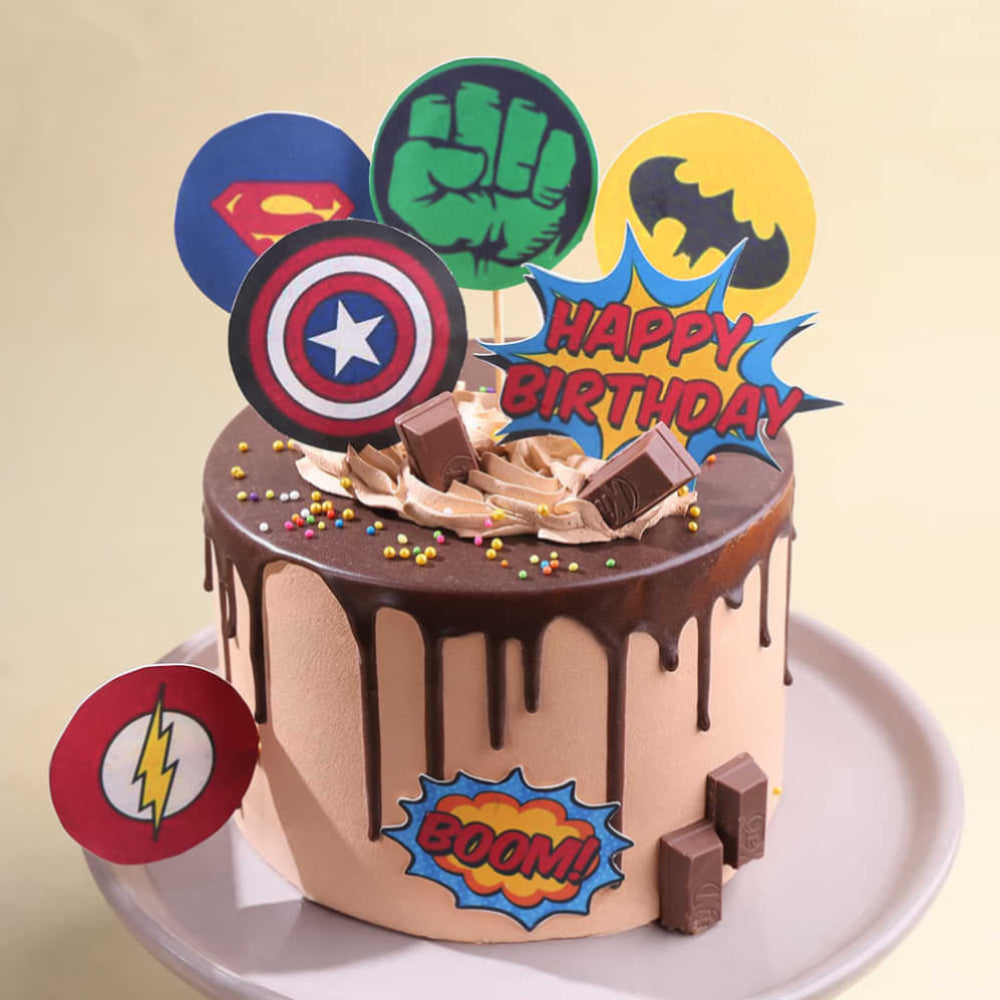 Chocolate cake with superhero-themed decorations on a beige background