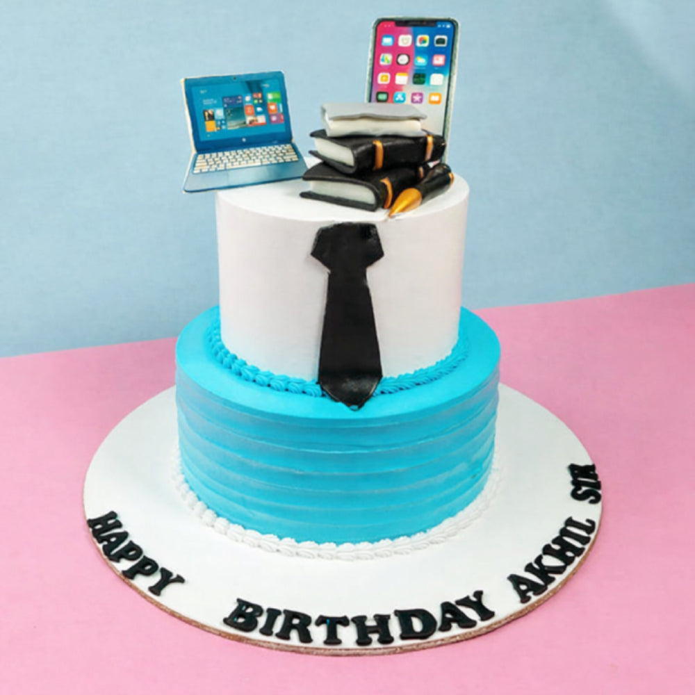 Gemini said
Two-tier professional birthday cake with laptop, phone, books, and tie.