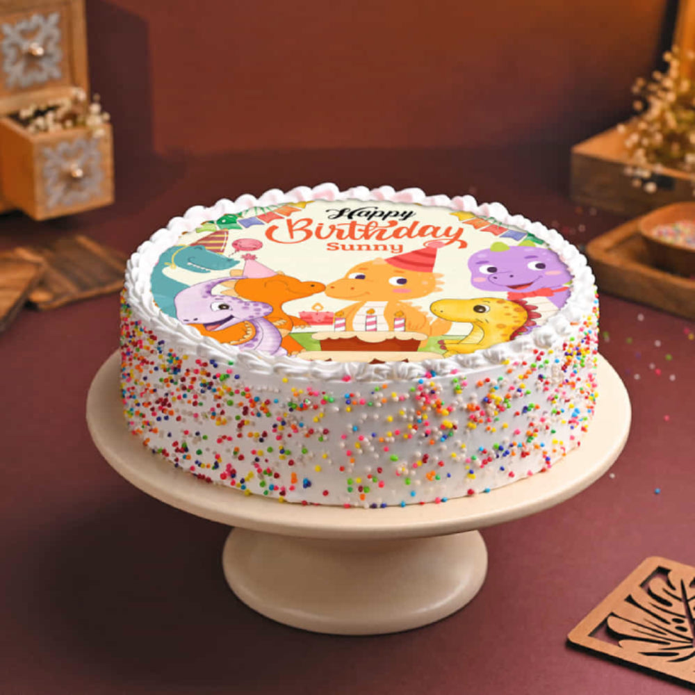 Birthday cake with cartoon characters on a white plate