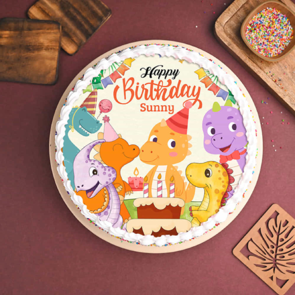 Birthday cake with cartoon dinosaurs and 'Happy Birthday Sunny' text on a maroon background