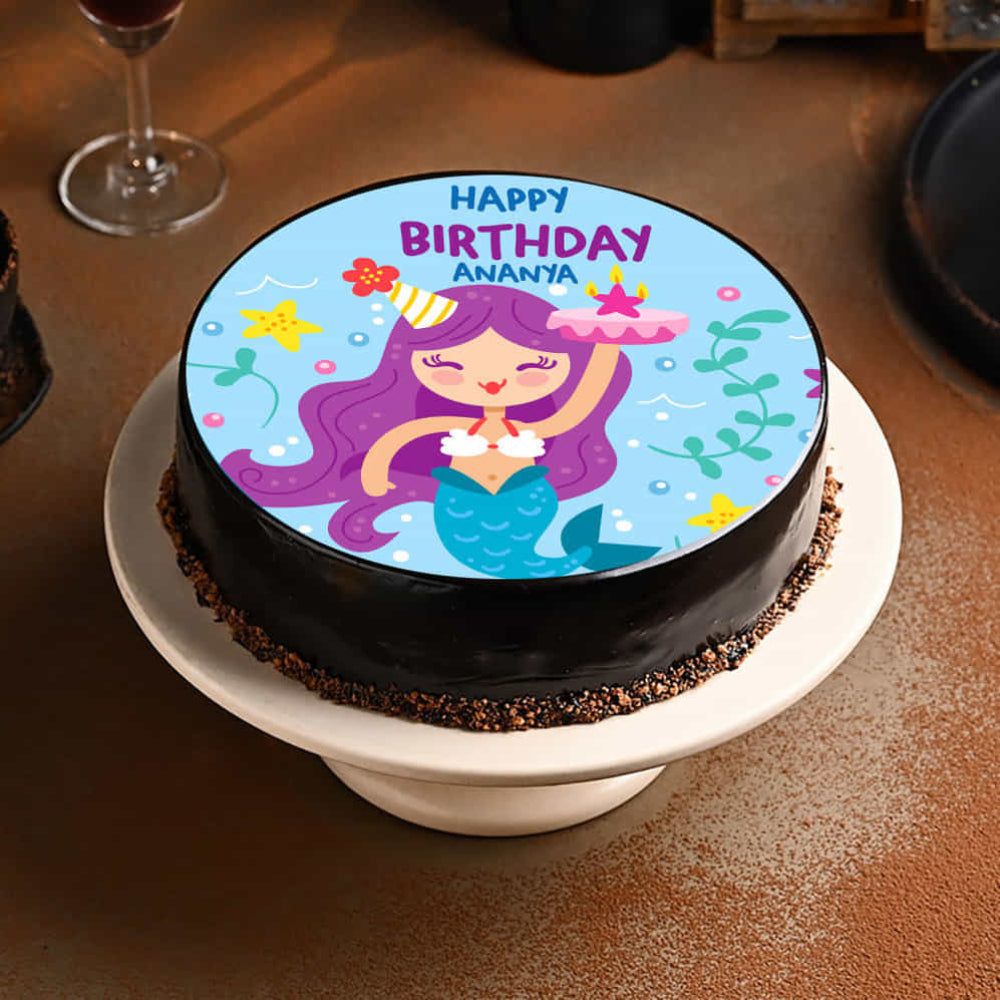 Chocolate birthday cake for girls featuring a purple-haired mermaid edible print and personalized "Happy Birthday Ananya" text.