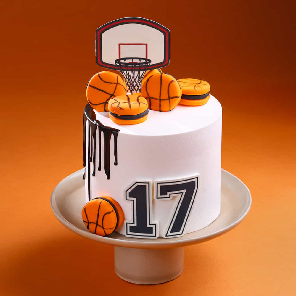 Cake decorated with basketball theme on an orange background
