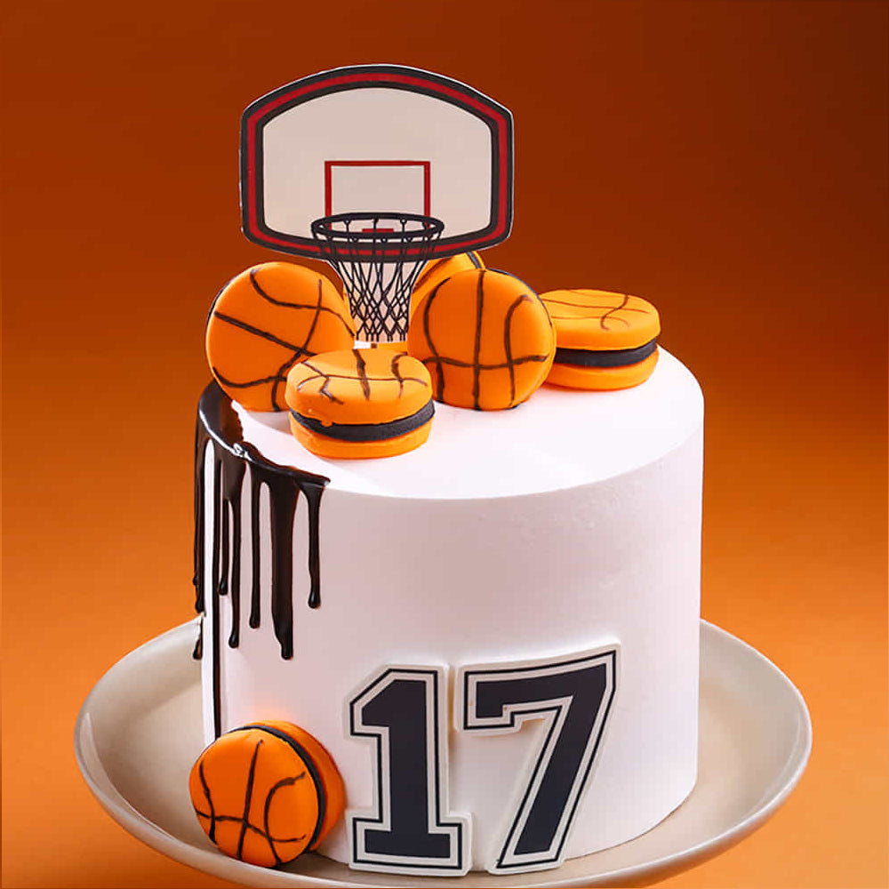 Cake with basketball theme including a hoop and number 17 on an orange background
