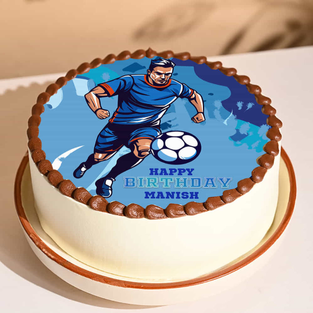 Birthday cake with a soccer player design and 'Happy Birthday Manish' text on a beige background