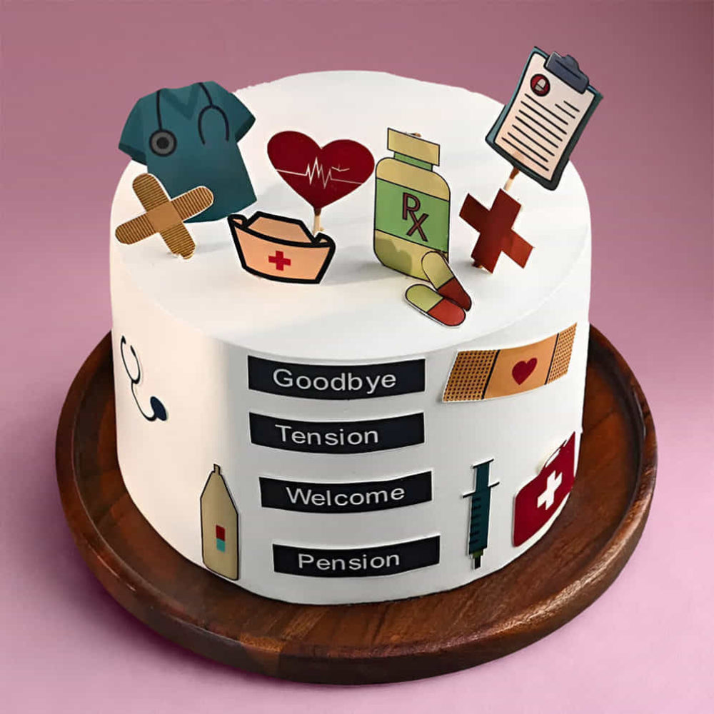 Doctor theme cake with medical icons and “Goodbye Tension Welcome Pension” message. top angle view