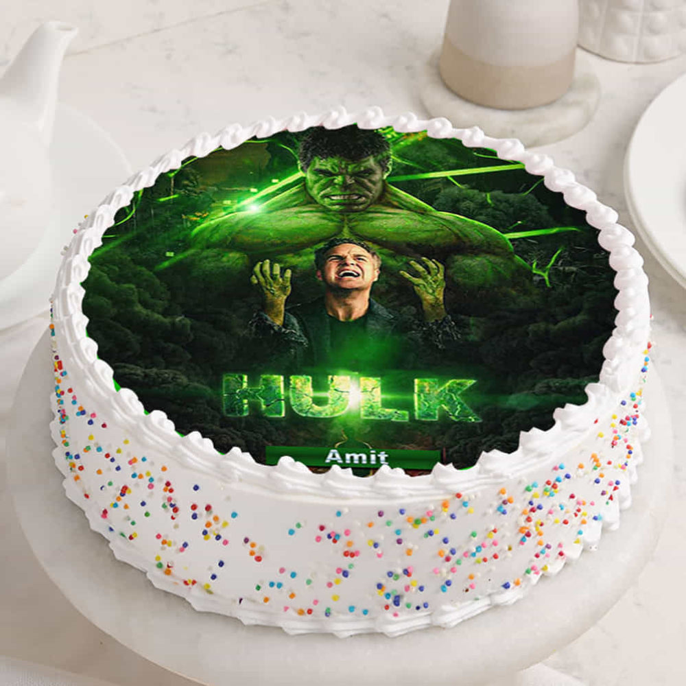 Cake with Hulk-themed design on a white surface