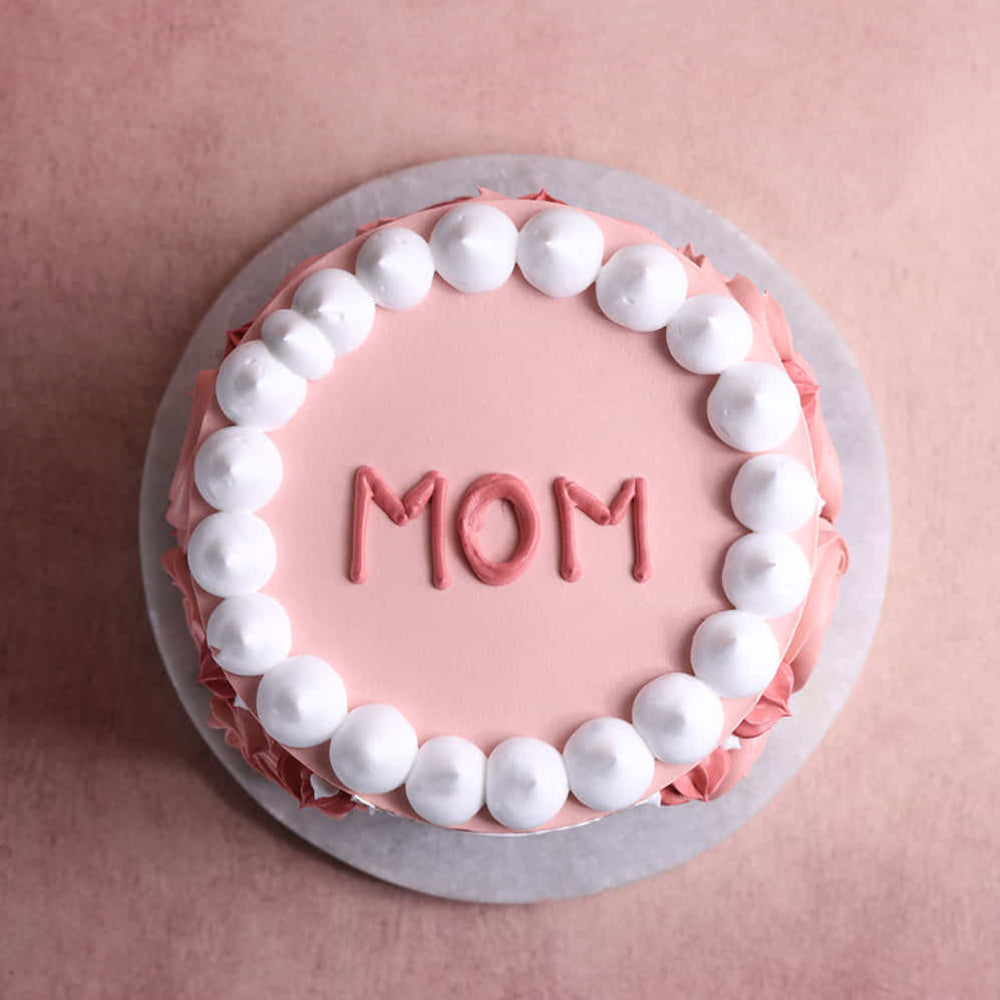 mother’s day cake with mom design and floral decoration. top view